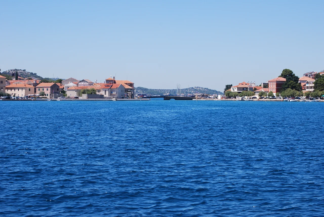 Tisno’s two shores and bridge across deep-blue water